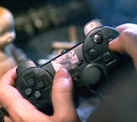 The movie’s chief villain, Zavulon, plays a Playstation 2 whose controller has its Sony and Playstation logos skillfully obscured by a sticker.
